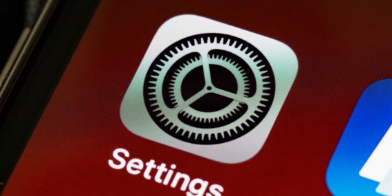 Detailed view of the iPhone screen showing the settings app icon.